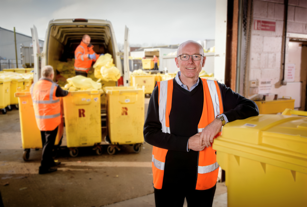 Medisort CEO Stuart Brittle pictured at its HQ with fleet