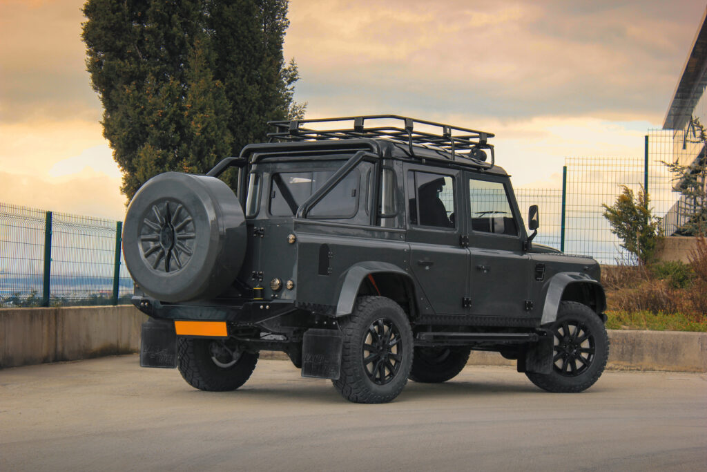 The rear side of the Monarch defender on a dusk skyline backdrop